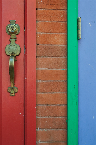 Detail of two colorful doors side-by-side.