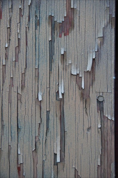 Peeling paint in muted hues.