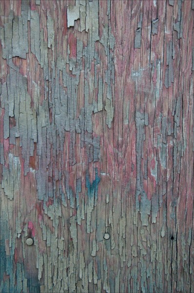 Peeling paint in pastel hues.